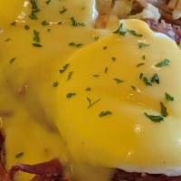 Corned Beef Hash Benedict · Grilled English muffin topped with corned beef hash, two poached eggs, and hollandaise sauce.