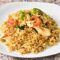 Spicy Thai Fried Rice · Choice of meat, onions, tomatoes, bell peppers, basil, chili and eggs.