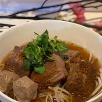 Stew Beef Noodle Soup · Slowly stewed beef in herb and spice until tender.  Served with piping brown broth with nood...