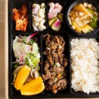 Premium Beef Bulgogi Box · Beef bulgogi, White rice, Kimchi, Salad, Side dishes, and Korean traditional soybean paste s...