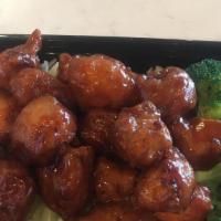 Sweet And Sour Chicken · White rice, broccoli, cabbage, chicken nuggets with sweet and sour sauce.