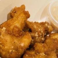 Bone In Wings · 8 wings. smothered in choice of honey bbq, garlic parmesean, gochujang sauce, and buffalo or...