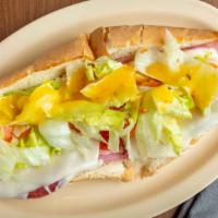 Submarine Special · Ham, pepperoni, salami, and cheese. Made with lettuce, tomato, onion, oil and vinegar, and s...