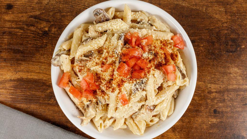 *New* Cajun Chicken Alfredo · Spicy grilled chicken and mushrooms, tossed in cajun alfredo sauce and topped with  Parmesan cheese.  Served with pretzel bread.