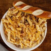 *New* Cheeseburger Mac Mac · The best of both worlds!  Sautéed ground beef with chopped bacon, caramelized onions and cre...
