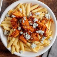 Buffalo Mac Mac · Bacon crumbles, creamy cheese sauce and penne pasta topped with crispy chicken tossed in med...