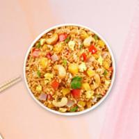 Pineapple Fried Rice · Stir-fried rice served with chicken, shrimp, egg, cashew nut, pineapple chunks, tomato and o...
