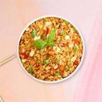 Thai Fried Rice · Stir-fried rice served with egg, tomato, and onion.