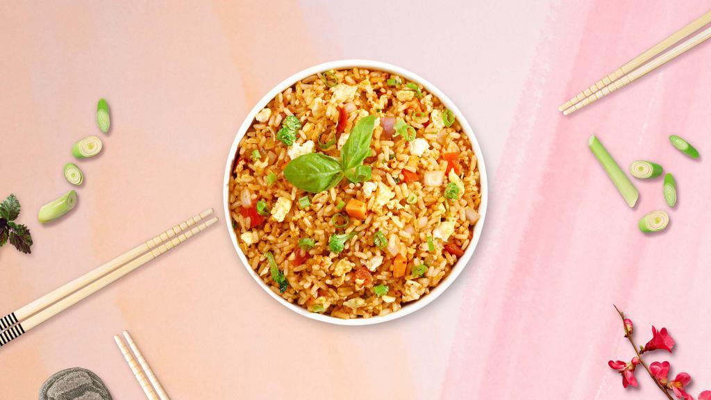 Thai Fried Rice · Stir-fried rice served with egg, tomato, and onion.