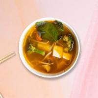 Tom Yum Soup · Exotic spices blended in lime juice with roasted chili paste, mushroom, tomatoes, jalapeno, ...