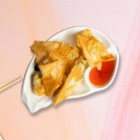 Crab Rangoon · (6 pieces) Crab and cream cheese stuffed wonton skin deep fried and served with sweet and so...