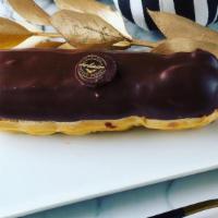 Classic Eclair · Filled with Vanilla pastry cream, topped with velvety dark chocolate ganache.