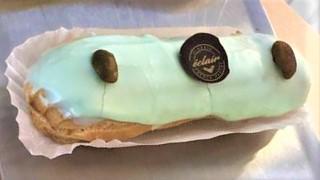 Pistachio Eclair · Filled with creamy pastry cream infused with ground pistachio and topped with fondant.