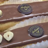 Nutella Eclair · Special. Filled with Nutella infused pastry cream and topped with creamy dark chocolate gana...