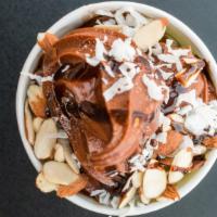 Chocolate Almond Delight · Chocolate frozen yogurt base.  Topped with shredded coconut, almonds and chocolate sauce.