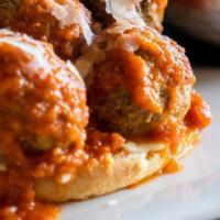 Meatball Sandwich · Tomaso's famous meatballs + tomato herb sauce + fresh mozzarella + basil + sesame encrusted ...