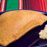 Sopapilla With Honey Butter · A homemade Mexican scone served with honey butter.