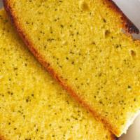 Garlic Bread · French bread seasoned with garlic, butter, and spices served with marinara sauce.