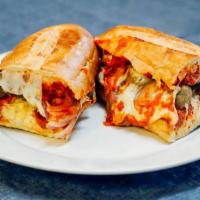 Meatball Parmesan Sub · Baked meatballs, onions, mozzarella and Parmesan cheese on French bread with our homemade ma...