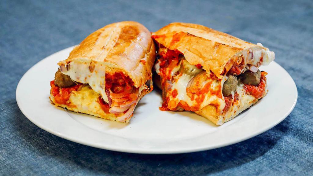 Meatball Parmesan Sub · Baked meatballs, onions, mozzarella and Parmesan cheese on French bread with our homemade marinara.
