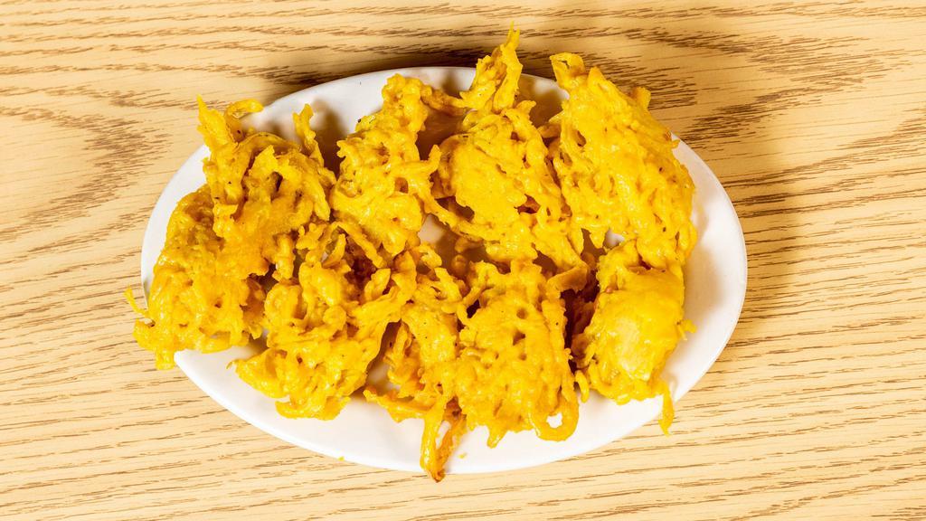 Onion Bhaji · Thinly sliced onions lightly deep fried in a flour batter.
