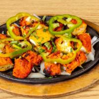 Chicken Tikka Kabab · Boneless breast of chicken marinated in yogurt with spices and roasted in a tandoor, a charc...
