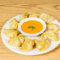 Meat Momo · Steamed meat dumpling served with tomato chutney.
