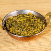 Saag Paneer · Finely chopped spinach with chunks of homemade cheese, special herbs and special spices.