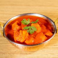 Chicken Vindaloo · Boneless chicken and potatoes cooked in hot curry sauce and tomato gravy.