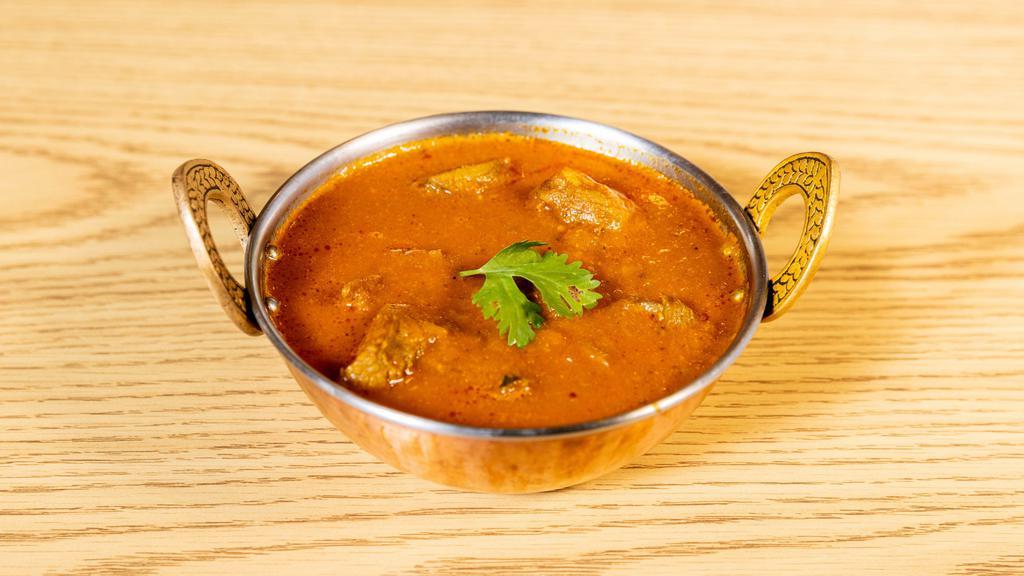 Lamb Curry · Pieces of lamb cooked in light curry sauce.
