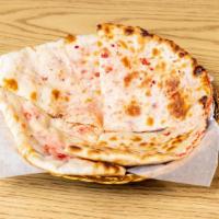 Kabuli Naan · Freshly baked naan with nuts and dried fruits.