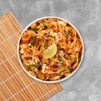 Pad Thai · Stir-fried rice noodle with egg, bean sprouts, scallions, carrot, lime, and crushed peanuts....
