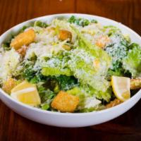 Caesar Salad · Romaine lettuce, seasoned croutons, shaved parmesan, classico dressing, lemon.