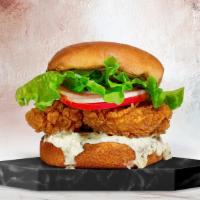 The Original Fried Chicken Sandwich · Dish out on crispy fried chicken with caper aioli, lettuce, and tomato. Add some fries to co...