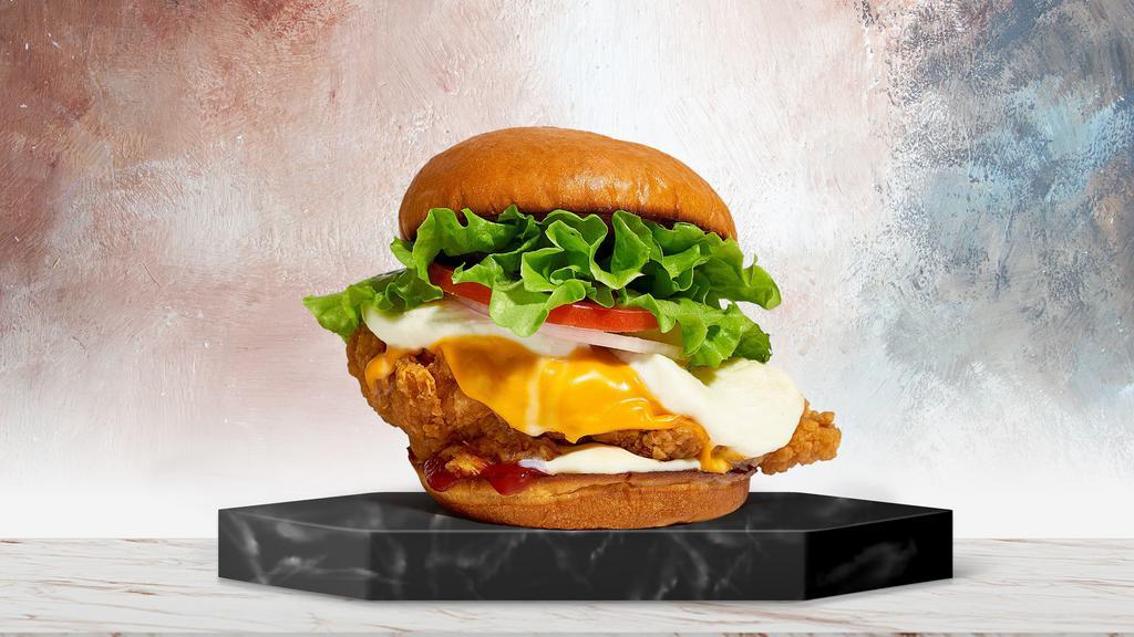 So Cheesy Chicken Sandwich · American cheese, nacho cheese, fried chicken breasts, lettuce, tomato, red onion, mayo, ketchup on a warm bun.