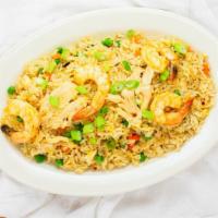 F 1. Golden Thai Spicy Fried Rice · Shrimps, chicken, eggs, onions, peas and carrots, corn and chili sauce.