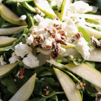 Arugula Pear Salad · Baby arugula, pears, shaved fennel, goat cheese & caramelized pecans served with our lemon h...