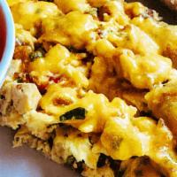 Protein Lover’S Scramble · Three eggs scrambled with grilled chicken, bacon, cheddar cheese & spinach, served with toas...