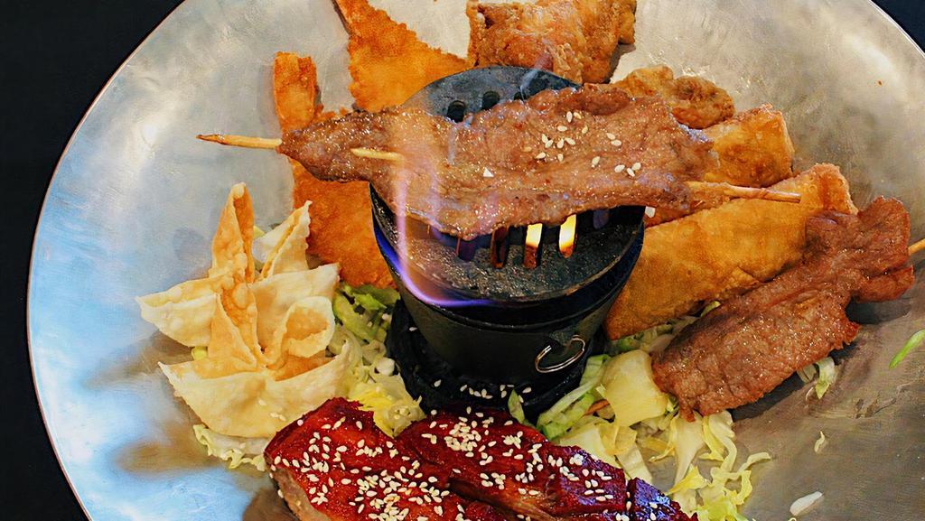 Pu Pu Platter · Minimum two people. Beef skewers, egg roll, crab rangoon, fried shrimp, chicken wings and BBQ ribs.