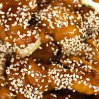 Sesame Beef Or Chicken · Pan-tossed lightly battered chicken or beef in a spicy sesame sauce, topped with sesame seeds.