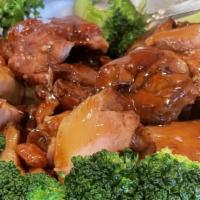 Bourbon Chicken · Oven-roasted dark meat chicken, topped with a bourbon sauce, bordered with broccoli