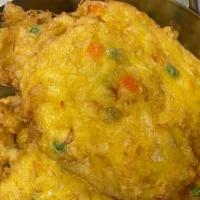 House Egg Foo Young · Chicken, pork, and shrimp with bean sprouts, cabbage, onions, peas, and carrots in an egg pa...