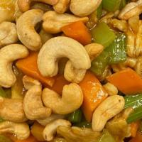 Cashew Chicken · Stir-fried white meat chicken with celery, carrots, and bamboo in a brown sauce, topped with...