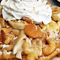 Banana Pudding · Banana pudding spread, fresh sliced bananas and Nilla wafers over a powder sugar funnel cake...