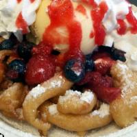 Red, White & Blueberry · Powder sugar funnel cake topped with Strawberries, Blueberries, Vanilla Ice Cream and Whip.