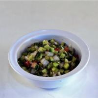 Shirazi Salad · Diced cucumbers, tomato, onion, in a citrus mint dressing.