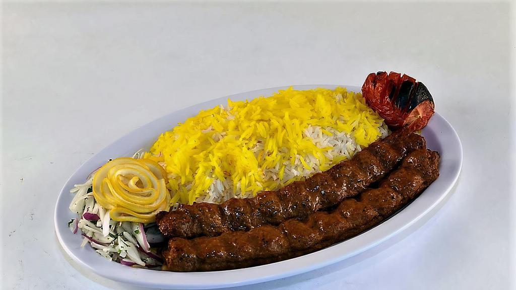Koobideh Kabob · Two skewers of our marinated ground beef, grilled on a skewer, served with grilled tomato and basmati rice.