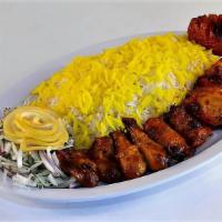 Bone-In-Chicken Kabob · A whole Cornish hen, cut, marinated & grilled on skewer, served with grilled tomato and basm...