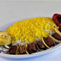 Lamb Shish Kabob · Halal. Tender lamb tenderloin, marinated and grilled on a skewer, served with grilled tomato...