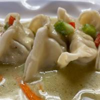A4 Steam Dumpling With Curry Sauce 6Pcs. · Chicken and veggies dumpling, topped with diced bell pepper and kaffir leaves.